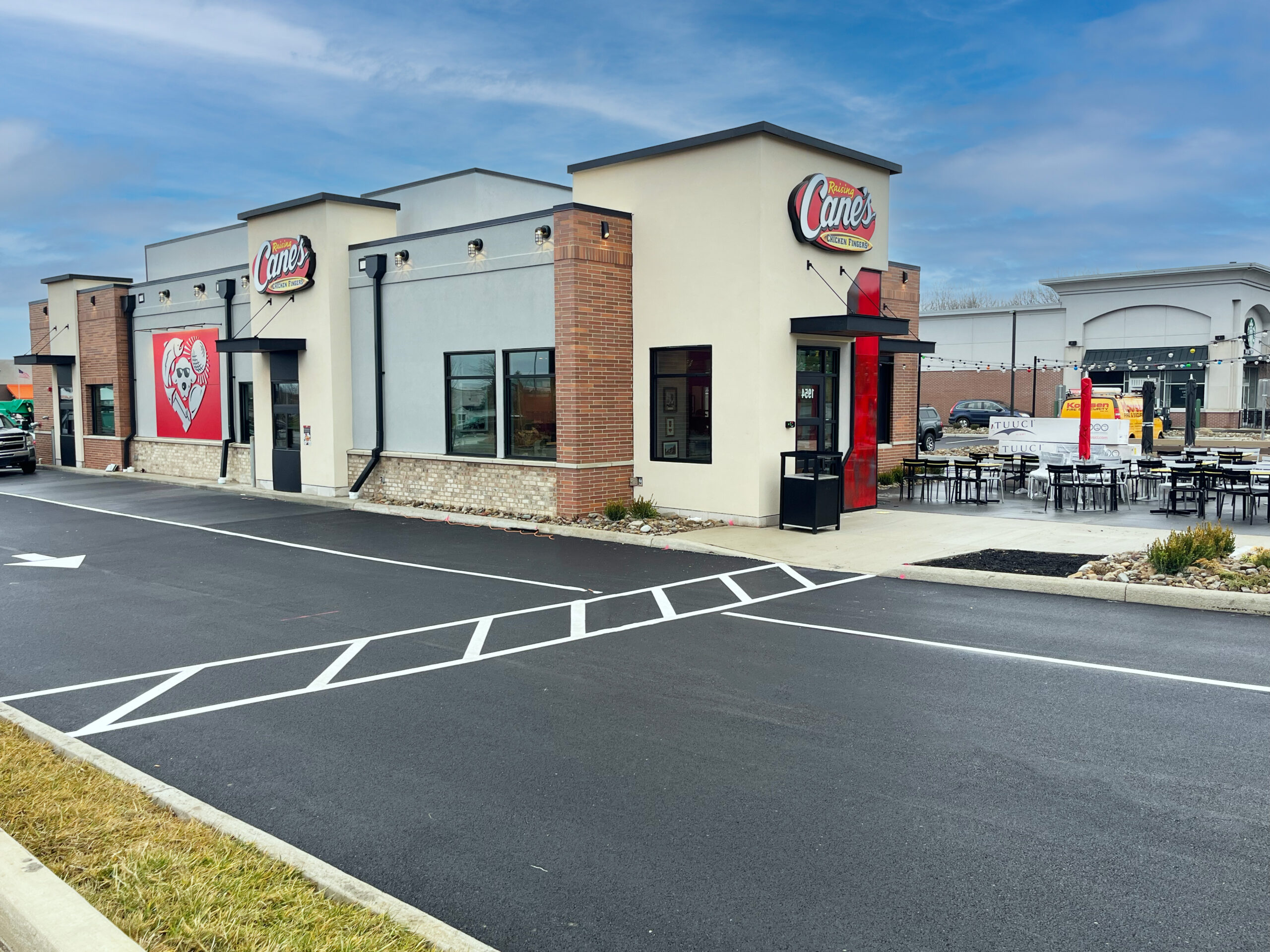 Final parking lot paving and striping for a Raising Cane's restaurant in Warren, OH